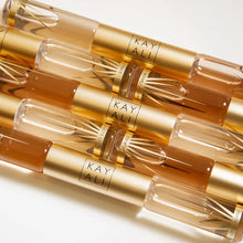 Cargar imagen en el visor de la galería, Kayali Déja Vu White Flower | 57 & Invite Only Amber | 23 Eau De Parfum Intense Rollerball (2 x 5ml)